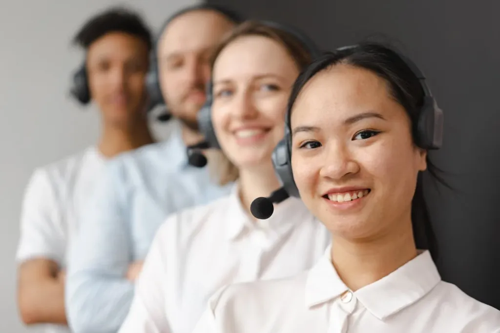 Smiling diverse support team wearing headsets